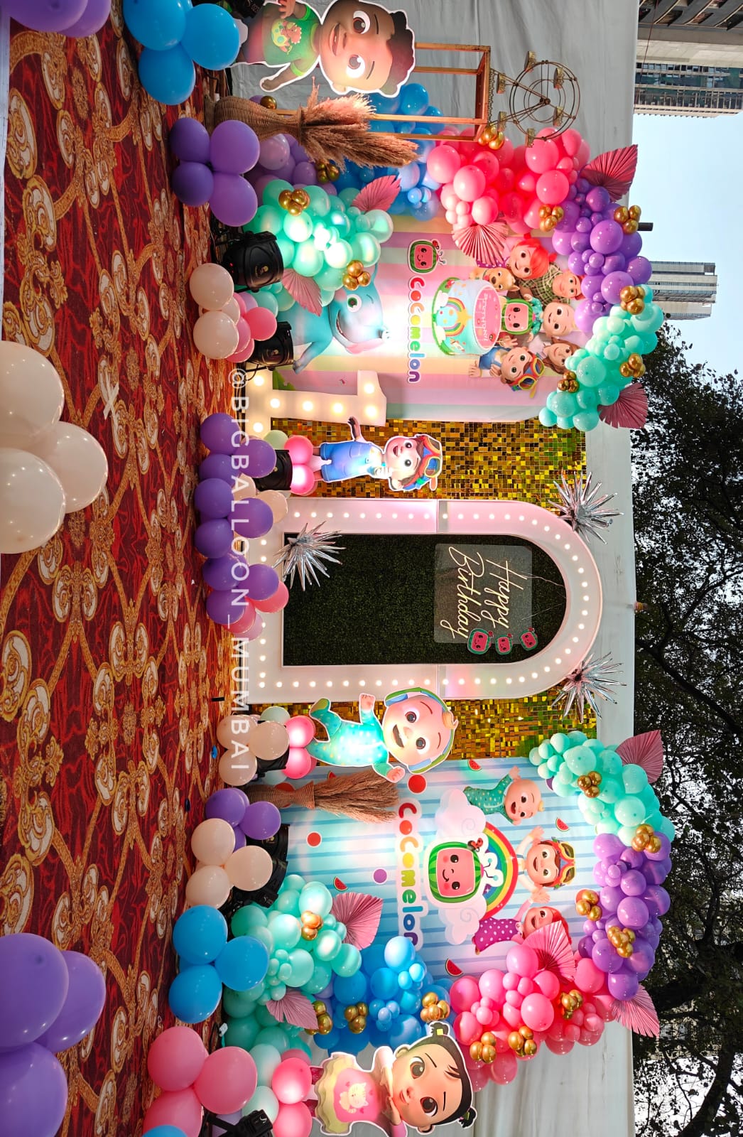 Stage setup and balloon styling for baby arrival celebration